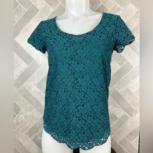 Talulah short sleeve top teal lace over navy button clasp